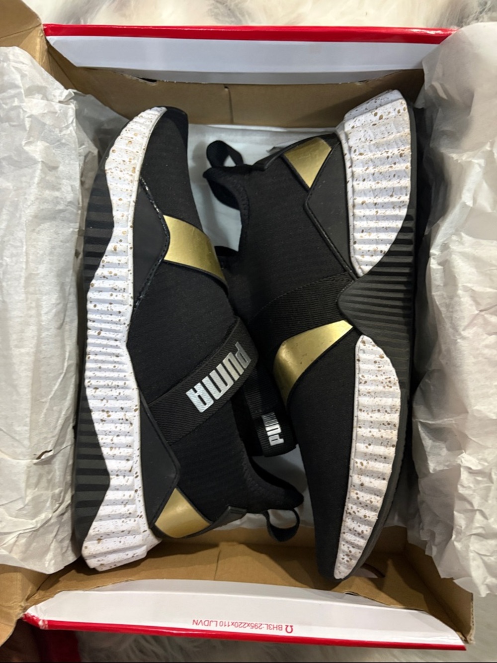 Puma Black and Gold Slip-On Athletic Shoes